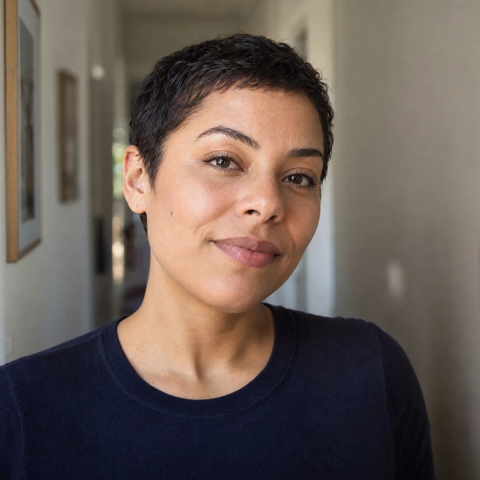 
Natural portrait of a woman with a hand near her hair